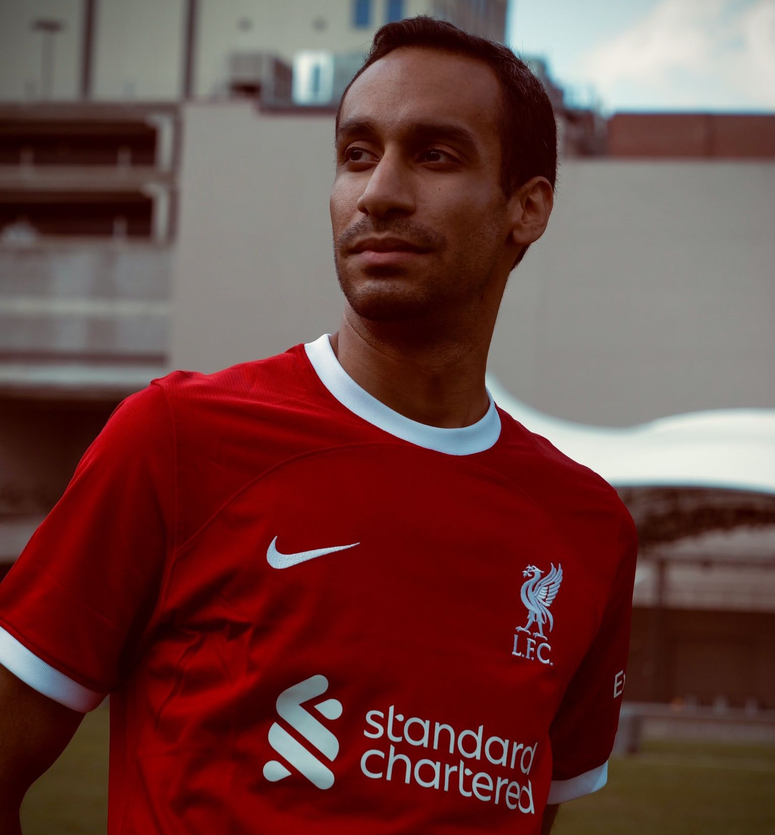 photo of me wearing a red Liverpool FC jersey looking at something outside the frame